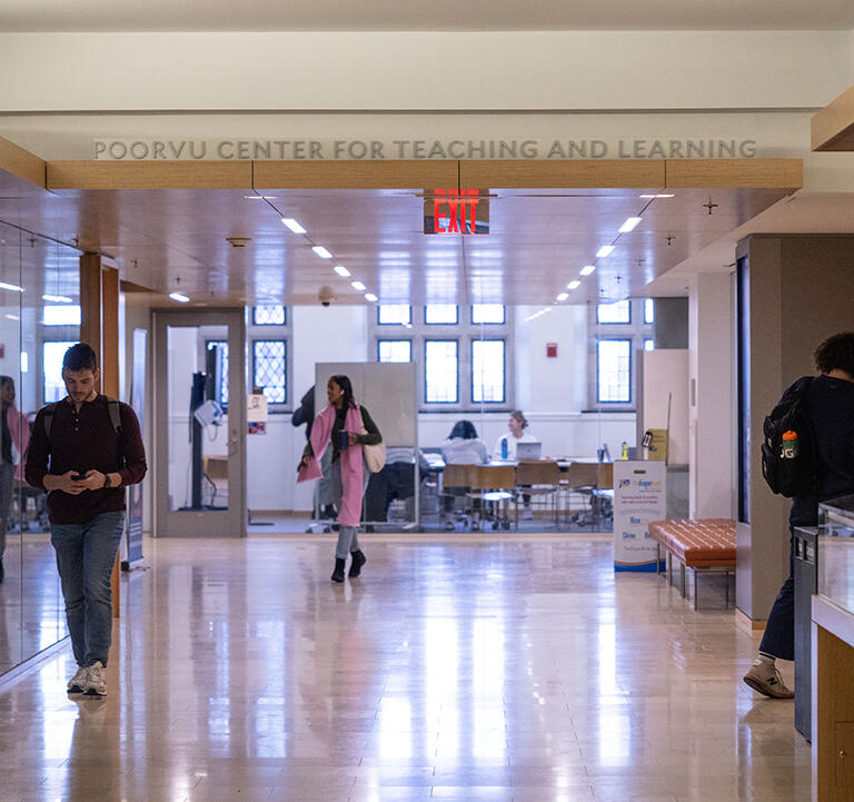 Students walking inside the Poorvu Center for Teaching and Learning